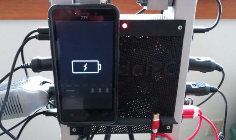 phone on PedalPC's phone charging shelf