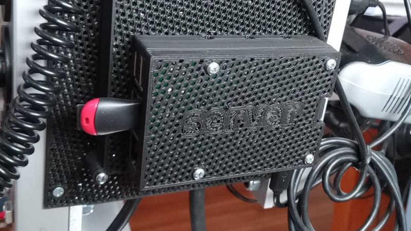 black 3D-printed mesh case enclosing a Raspberry Pi 3 web server with the word 'server' inlayed on top